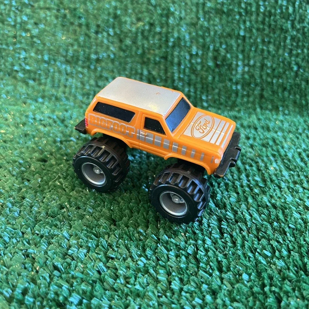 McDonalds Happy Meal Toys‎ 1987 Ford Bigfoot Trucks, orange truck